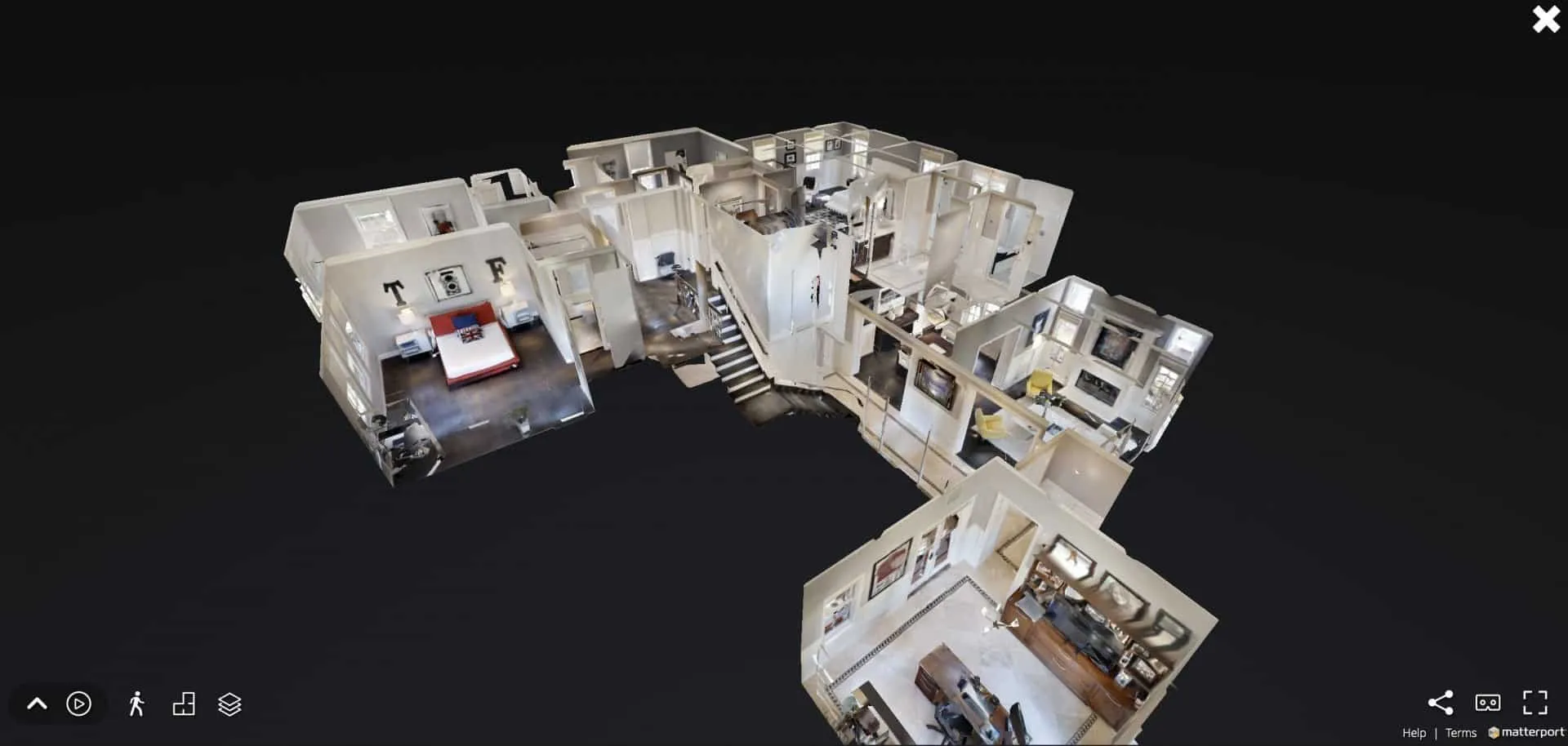 Matterport 3D dollhouse view of a home with a bedroom, central staircase and wood-paneled study